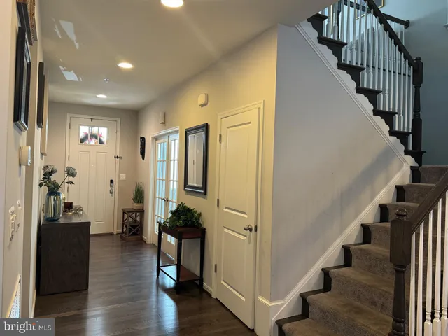 a kitchen with a granite countertop sink a stove and refrigerator