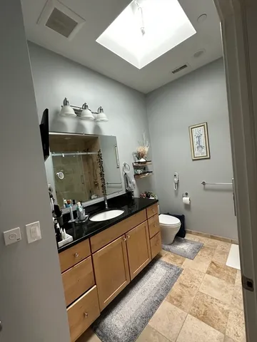 a bathroom with a sink and mirror