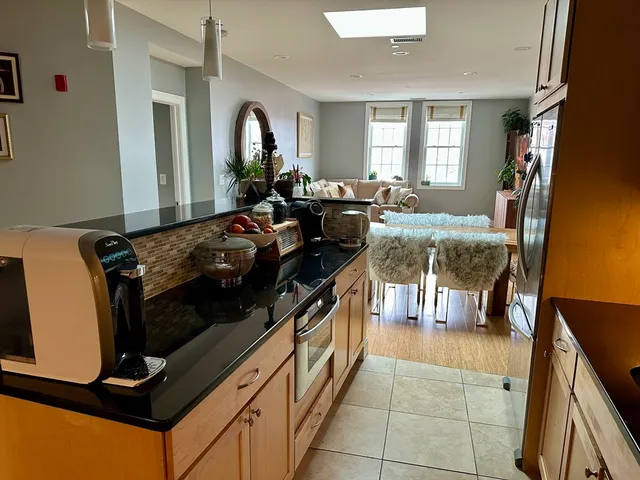 a kitchen with a stove and a refrigerator