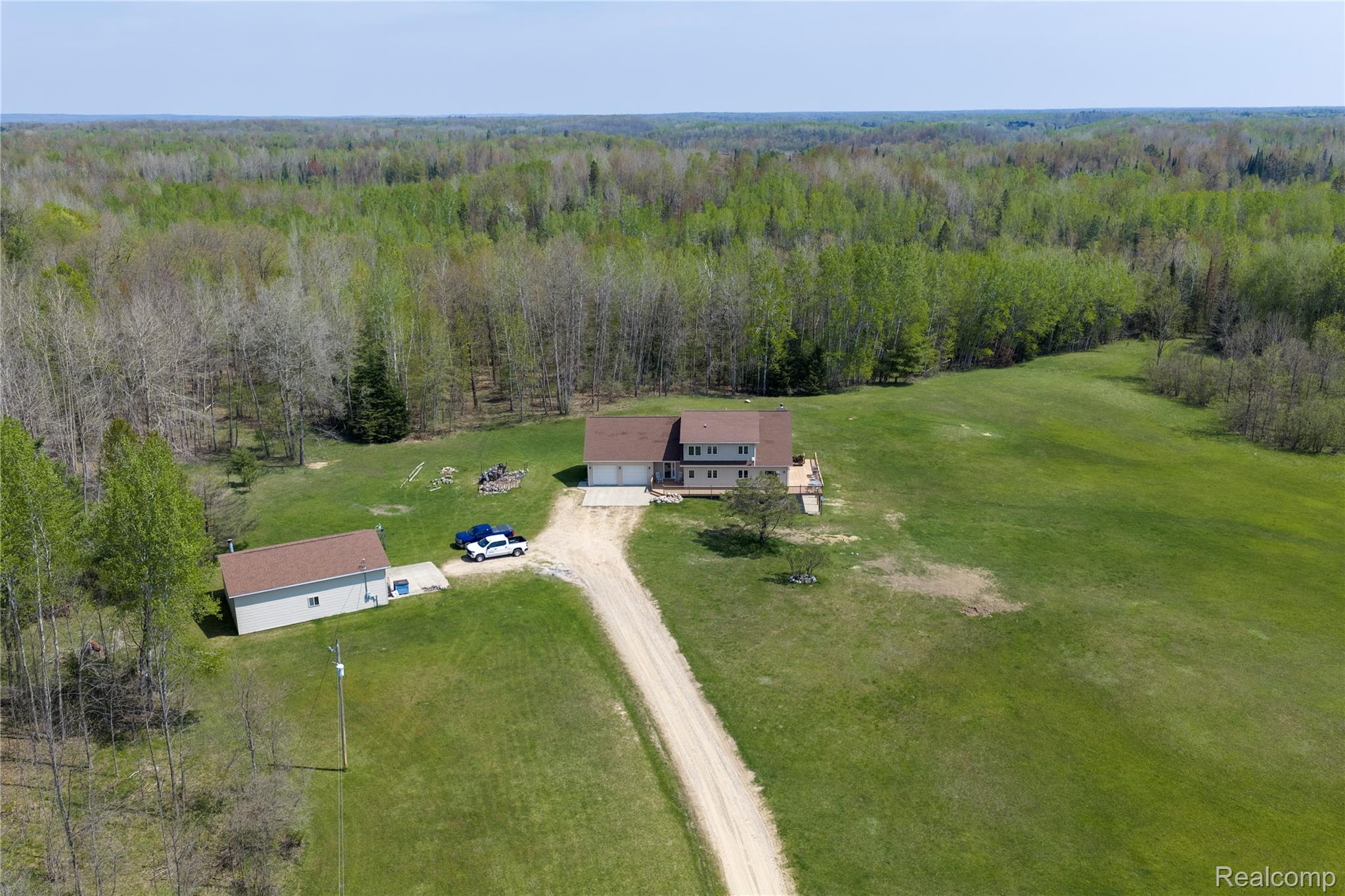 4180 Sage Lake Road Lupton, MI 48635 - Photo 29 of 40 Bird's eye view of a heavily wooded area