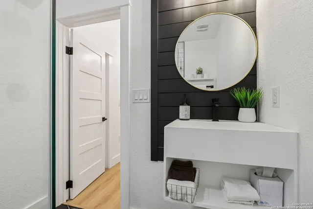 a bathroom with a sink and toilet