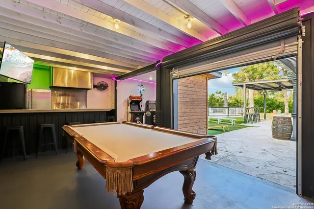 a patio with yard and outdoor seating