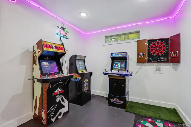 a view of backyard with swimming pool and seating