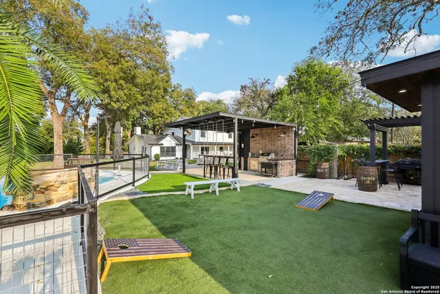 a view of a patio with swimming pool table and chairs