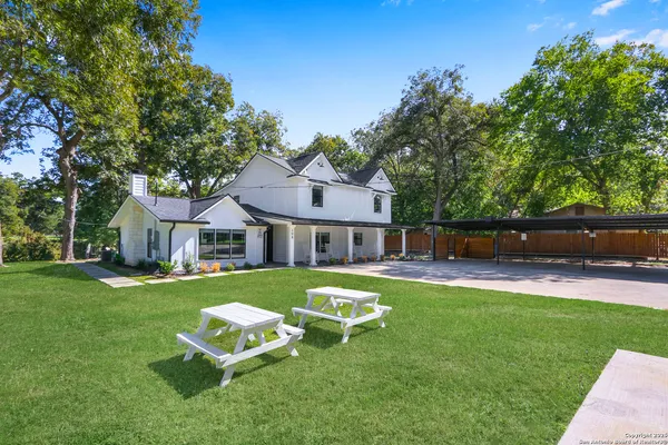 a view of a house with a yard porch and sitting area