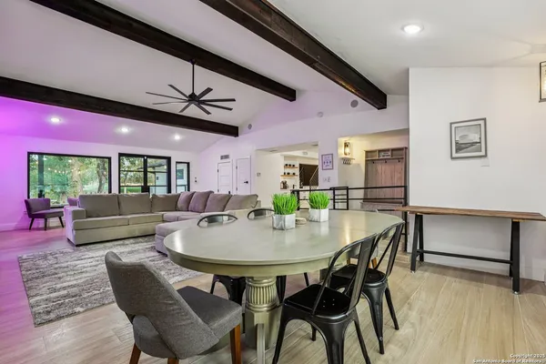 a dining room with furniture and window
