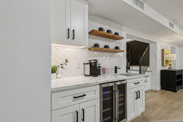 a kitchen with stainless steel appliances granite countertop a sink and dishwasher
