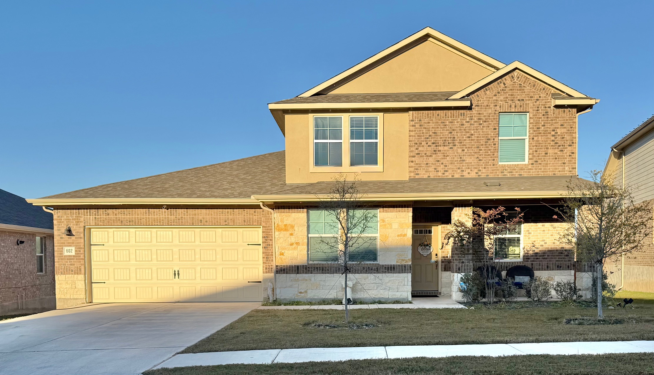 602 Sue Peaks Loop Dripping Springs, TX 78620 - Photo 1 of 39 a front view of a house with a yard
