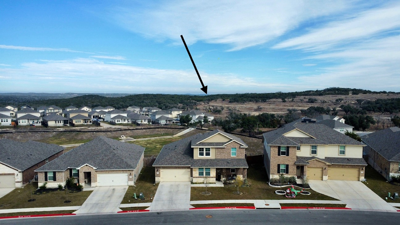 602 Sue Peaks Loop Dripping Springs, TX 78620 - Photo 13 of 39 an aerial view of a house with a ocean view