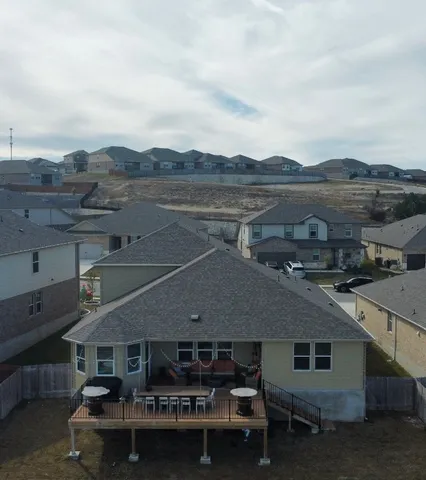 an aerial view of a house with a ocean view
