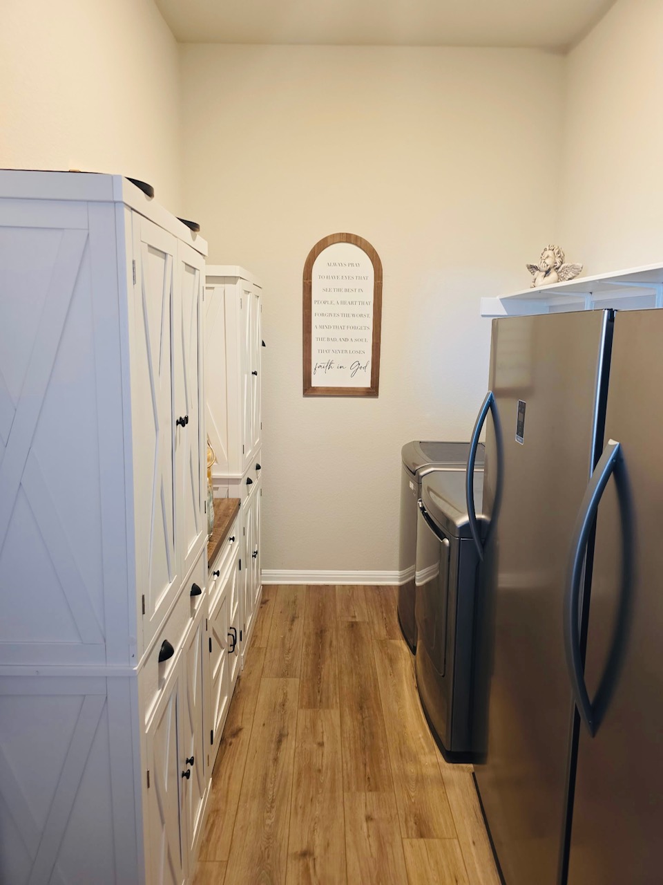 602 Sue Peaks Loop Dripping Springs, TX 78620 - Photo 24 of 39 a view of a livingroom with wooden floor and staircase