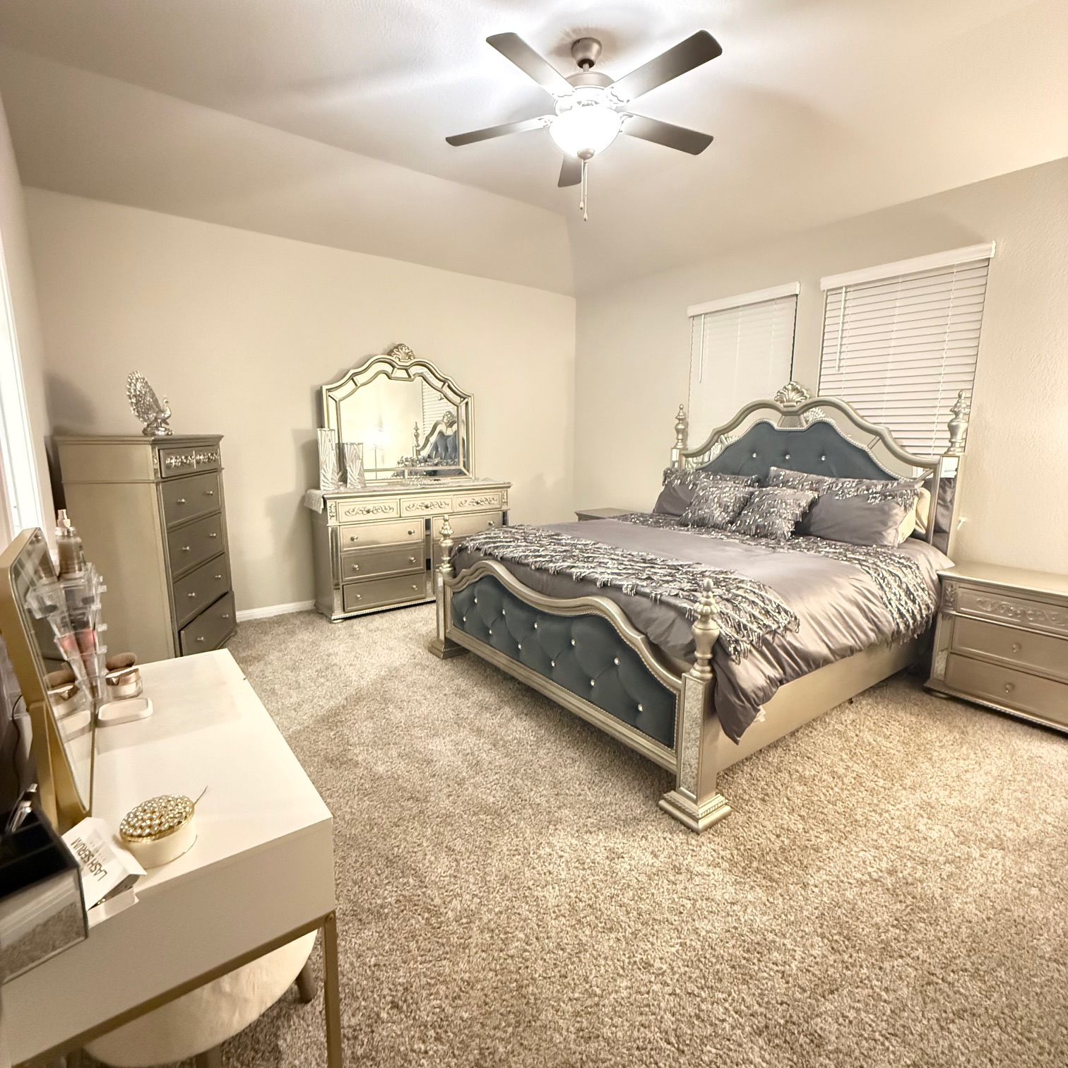 602 Sue Peaks Loop Dripping Springs, TX 78620 - Photo 25 of 39 a bedroom with a bed and a chandelier