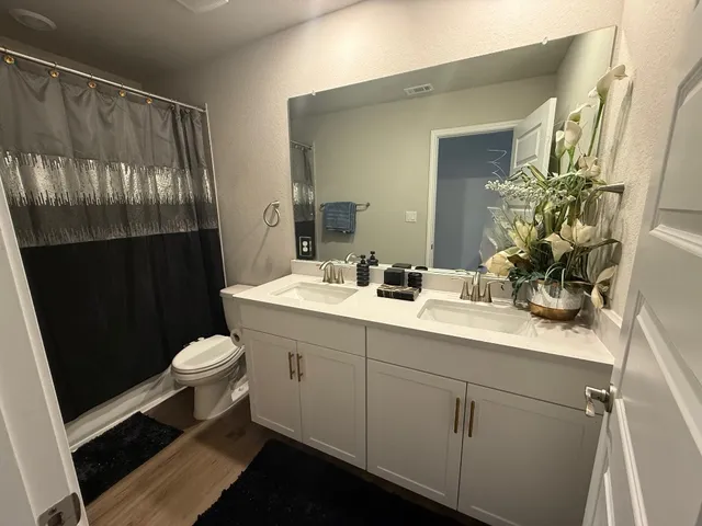 a outdoor patio with swimming pool table and chairs