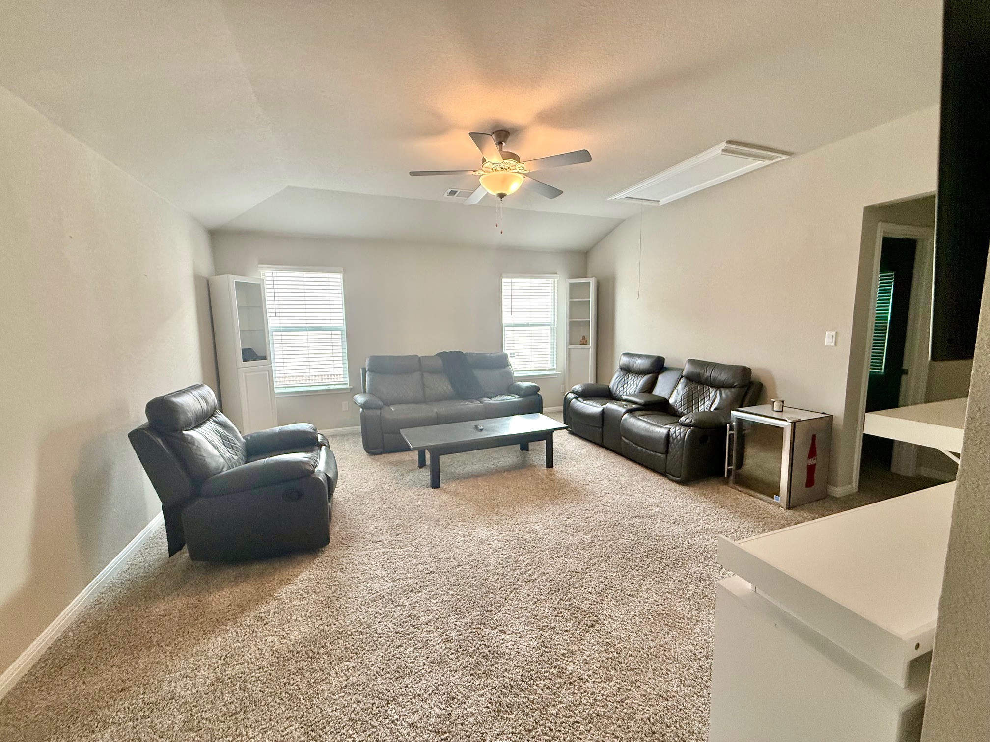 602 Sue Peaks Loop Dripping Springs, TX 78620 - Photo 30 of 39 a living room with furniture and a chandelier