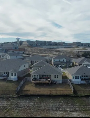 an aerial view of a house with a ocean view