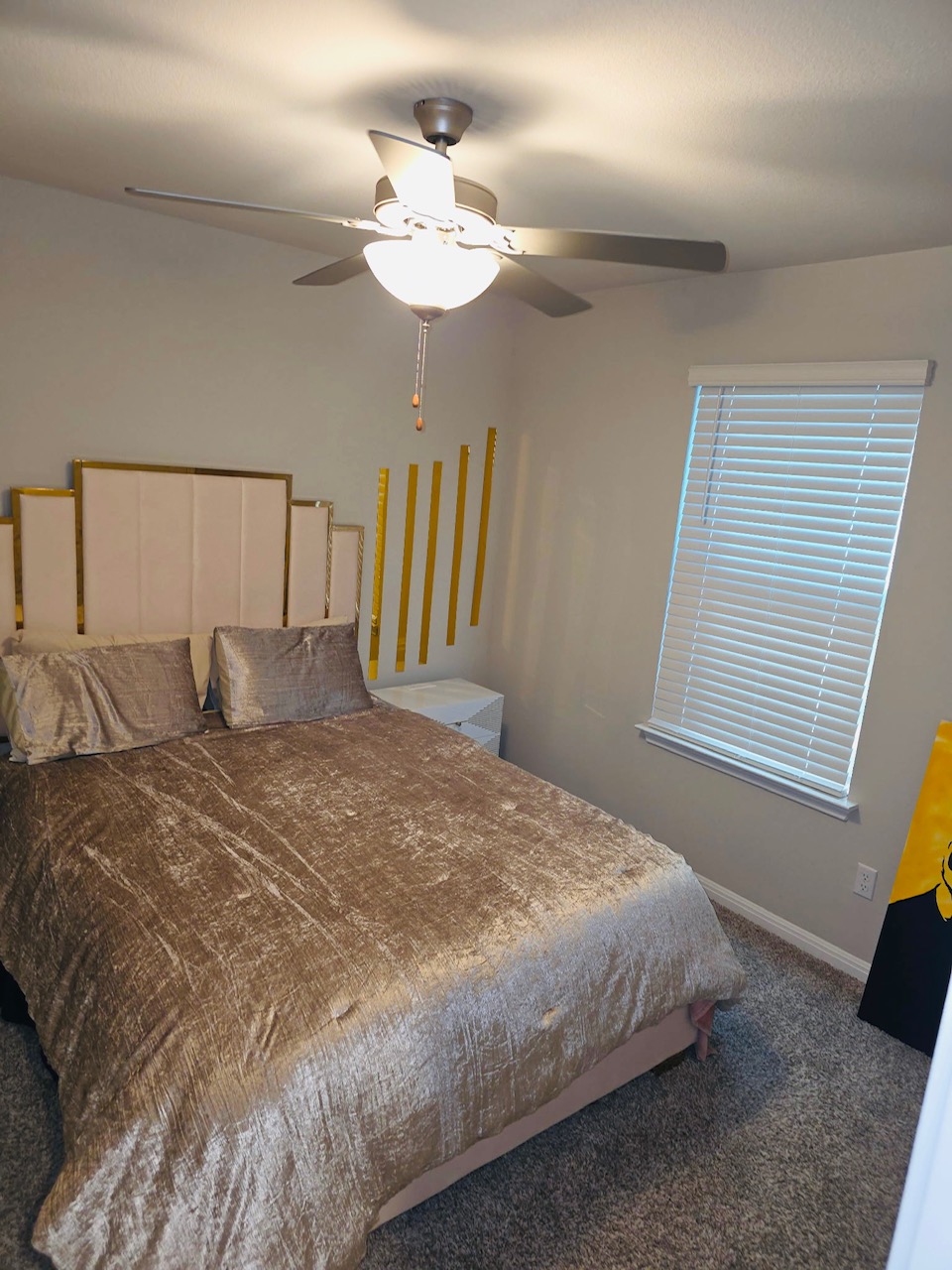 602 Sue Peaks Loop Dripping Springs, TX 78620 - Photo 33 of 39 a bedroom with a large bed and a chandelier