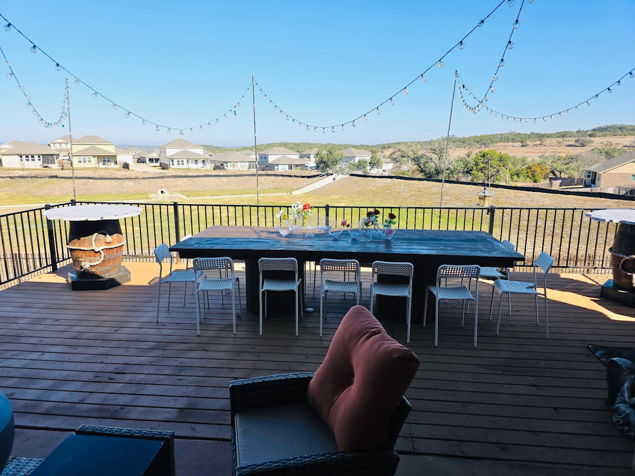 602 Sue Peaks Loop Dripping Springs, TX 78620 - Photo 5 of 39 a roof deck with table and chairs