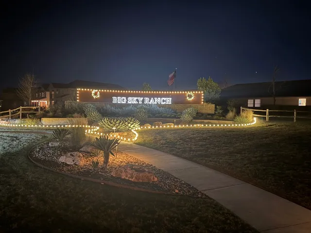 a view of a hallway with wooden floor and closet