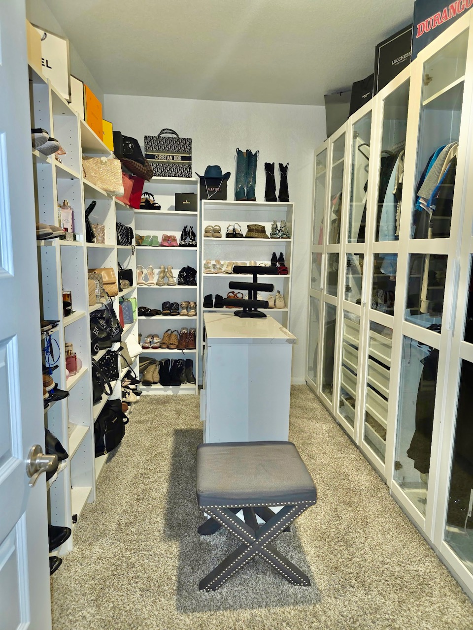 602 Sue Peaks Loop Dripping Springs, TX 78620 - Photo 8 of 39 a view of walk in closet with clothes and shoes