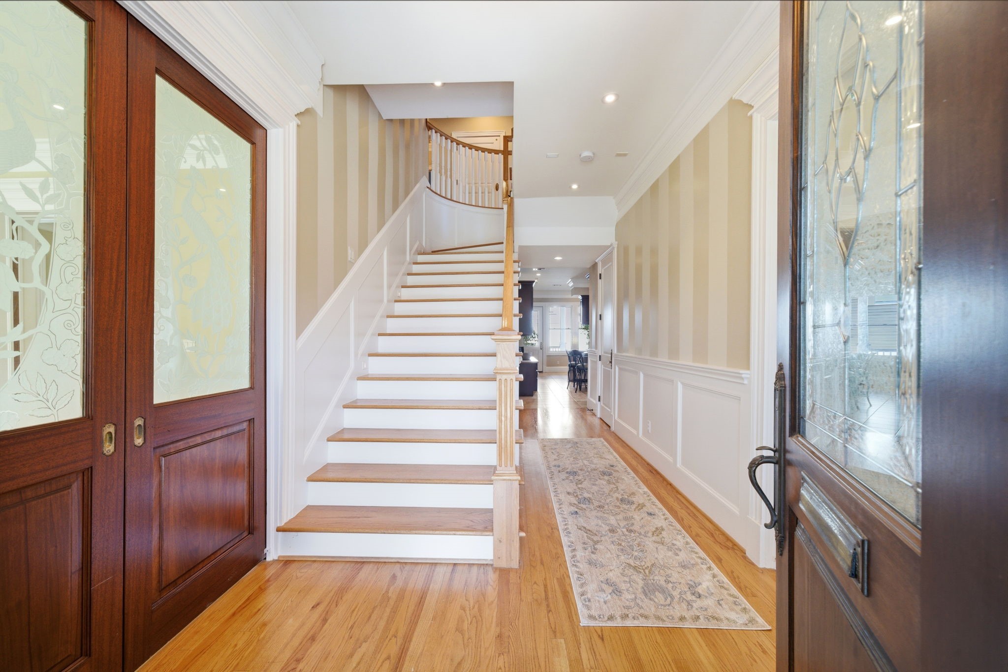 607 East 15th Street Houston, TX 77008 - Photo 6 of 50 As you enter the spacious foyer you're met with the paneled stairway, and double wood pocket doors with decorative glass on both sides, leading to the formal living and dining rooms.