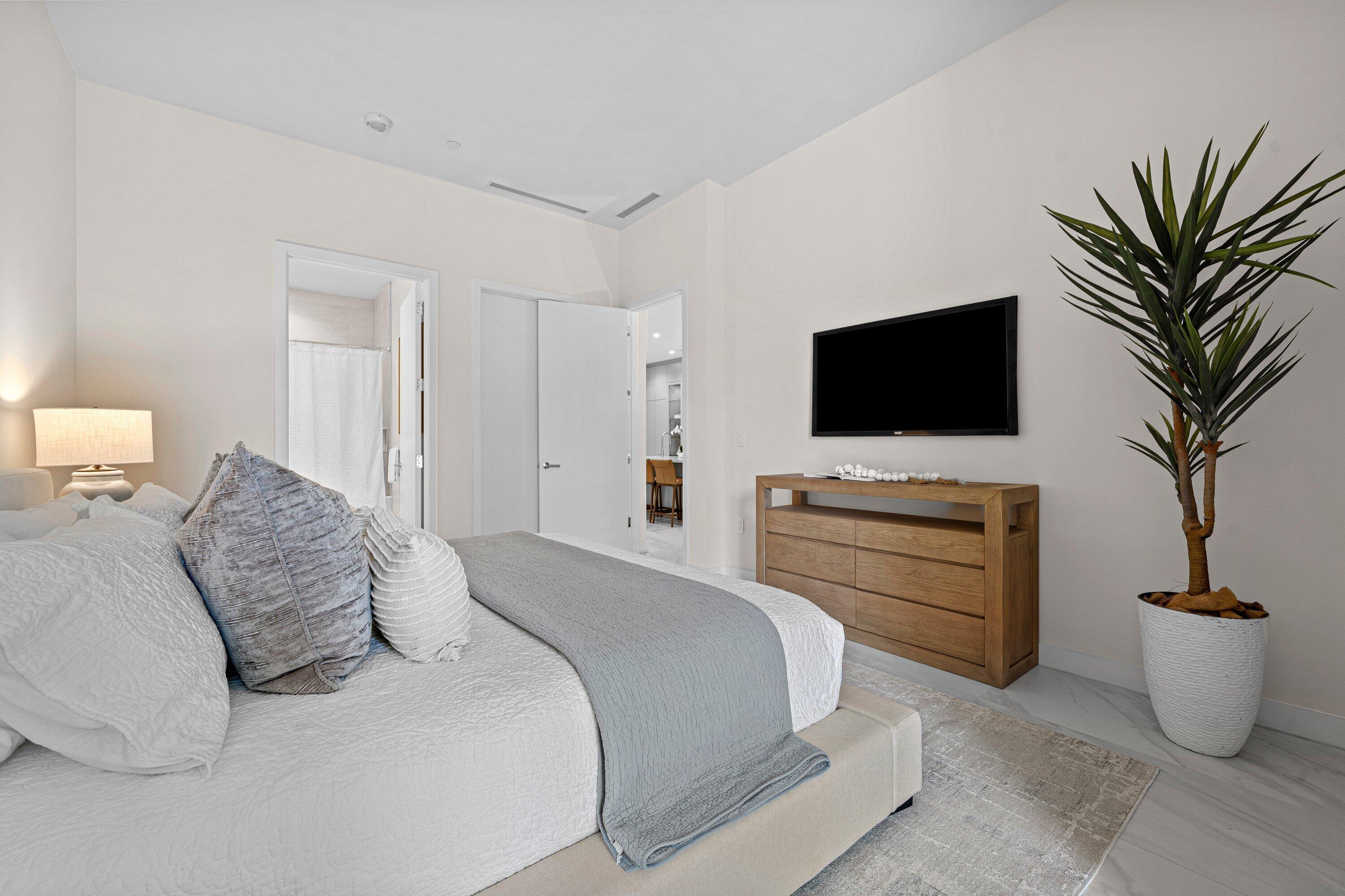 220 Southeast Mizner Boulevard, Unit 102 Boca Raton, FL 33432 - Photo 13 of 55 Primary Bedroom