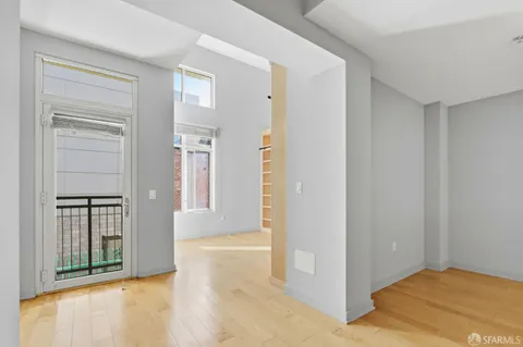 a view of walk in closet with empty racks