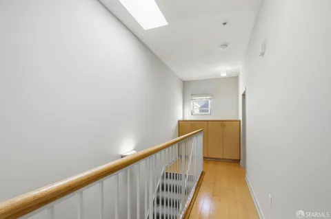a view of a livingroom with a ceiling fan and entryway