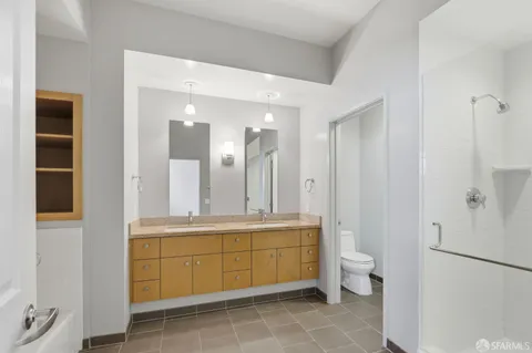 a bathroom with a tub sink and mirror