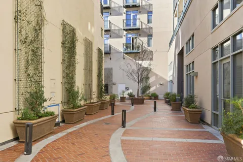 a view of a building with potted plants