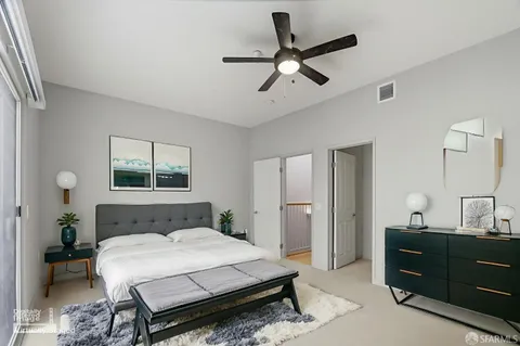 a bedroom with a bed and a dresser