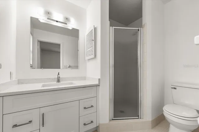 a bathroom with a sink vanity and mirror