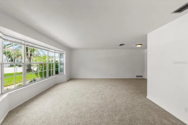 a view of a big room with a large window