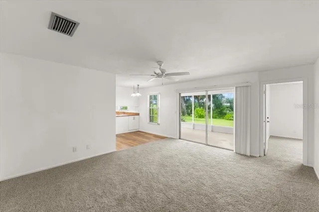 an empty room with windows and entrance