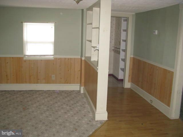 17 White Post Road White Post, VA 22663 - Photo 5 of 10 a view of an empty room with wooden floor and a window