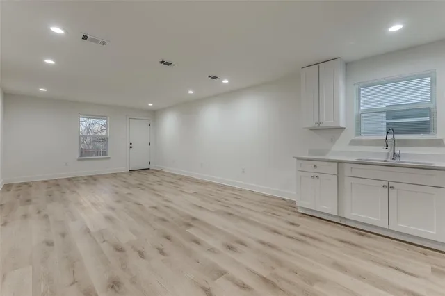 a view of a kitchen with sink and dishwasher