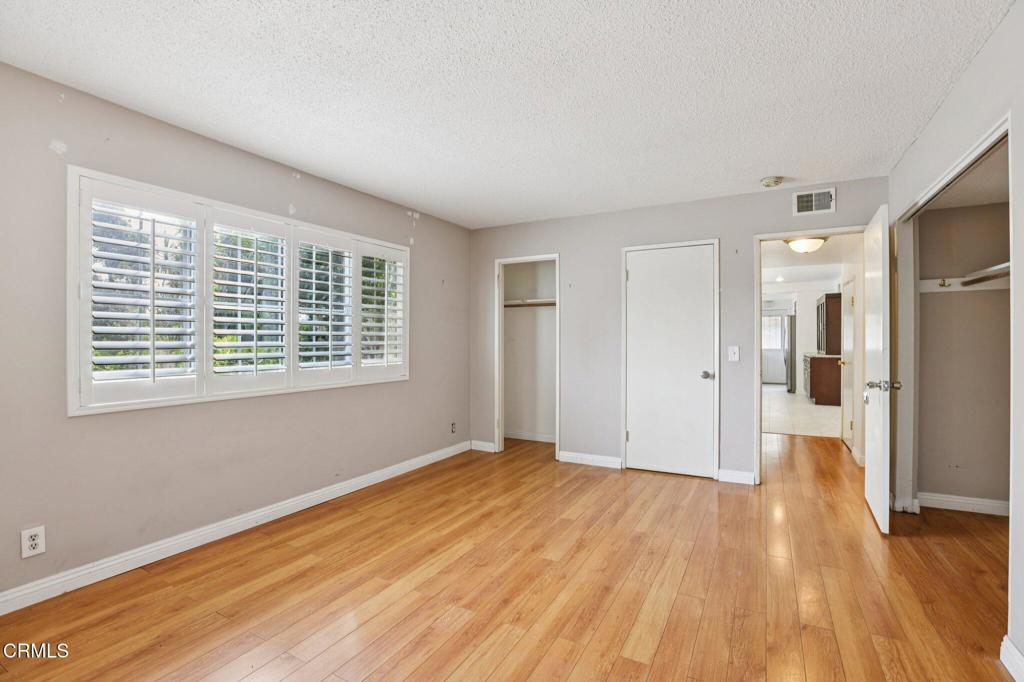 10856 Topeka Drive Porter Ranch, CA 91326 - Photo 15 of 40 a view of a big room with wooden floor and a window