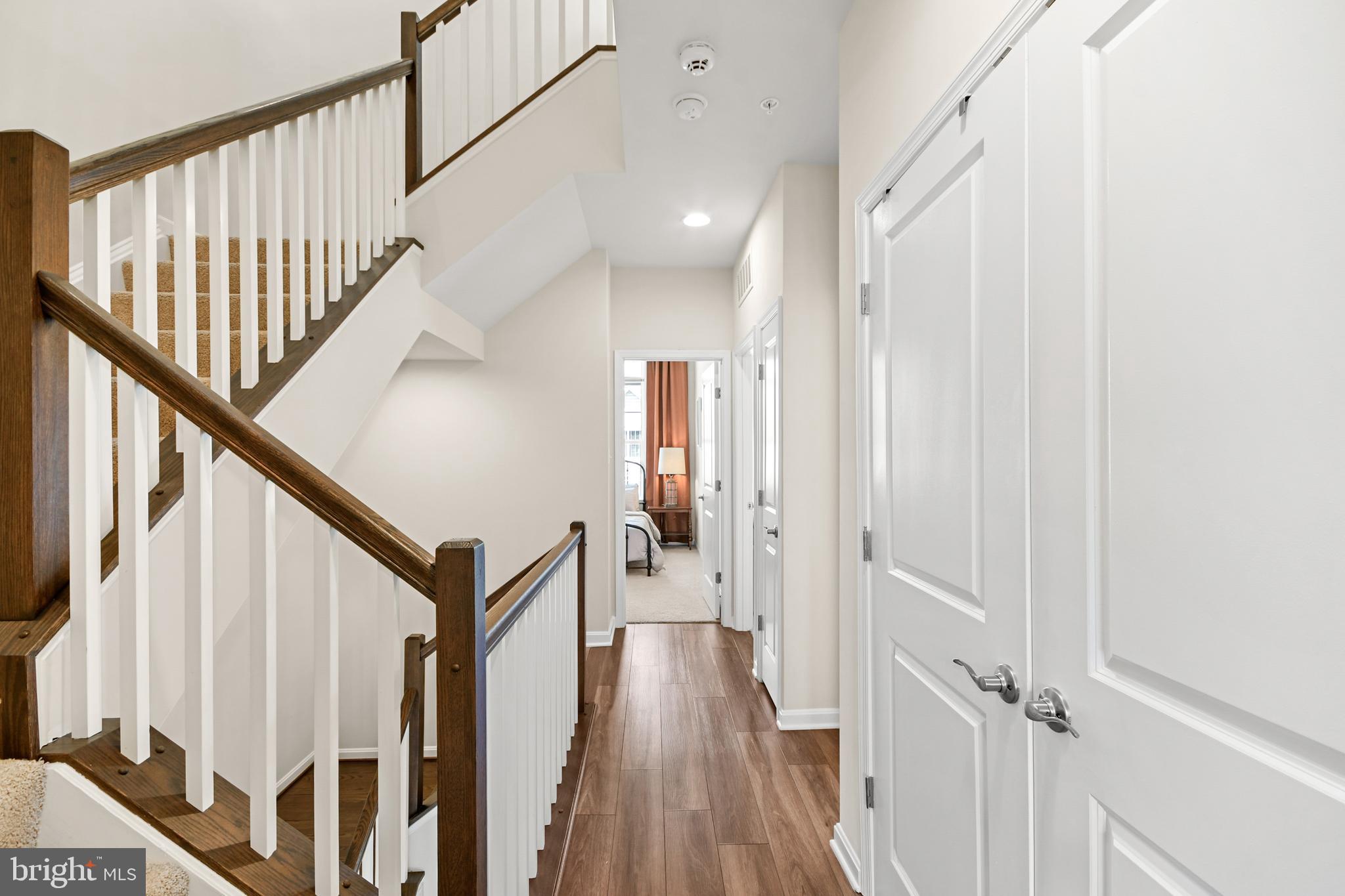 933 Holden Road Frederick, MD 21701 - Photo 50 of 80 a view of a hallway with wooden floor and staircase