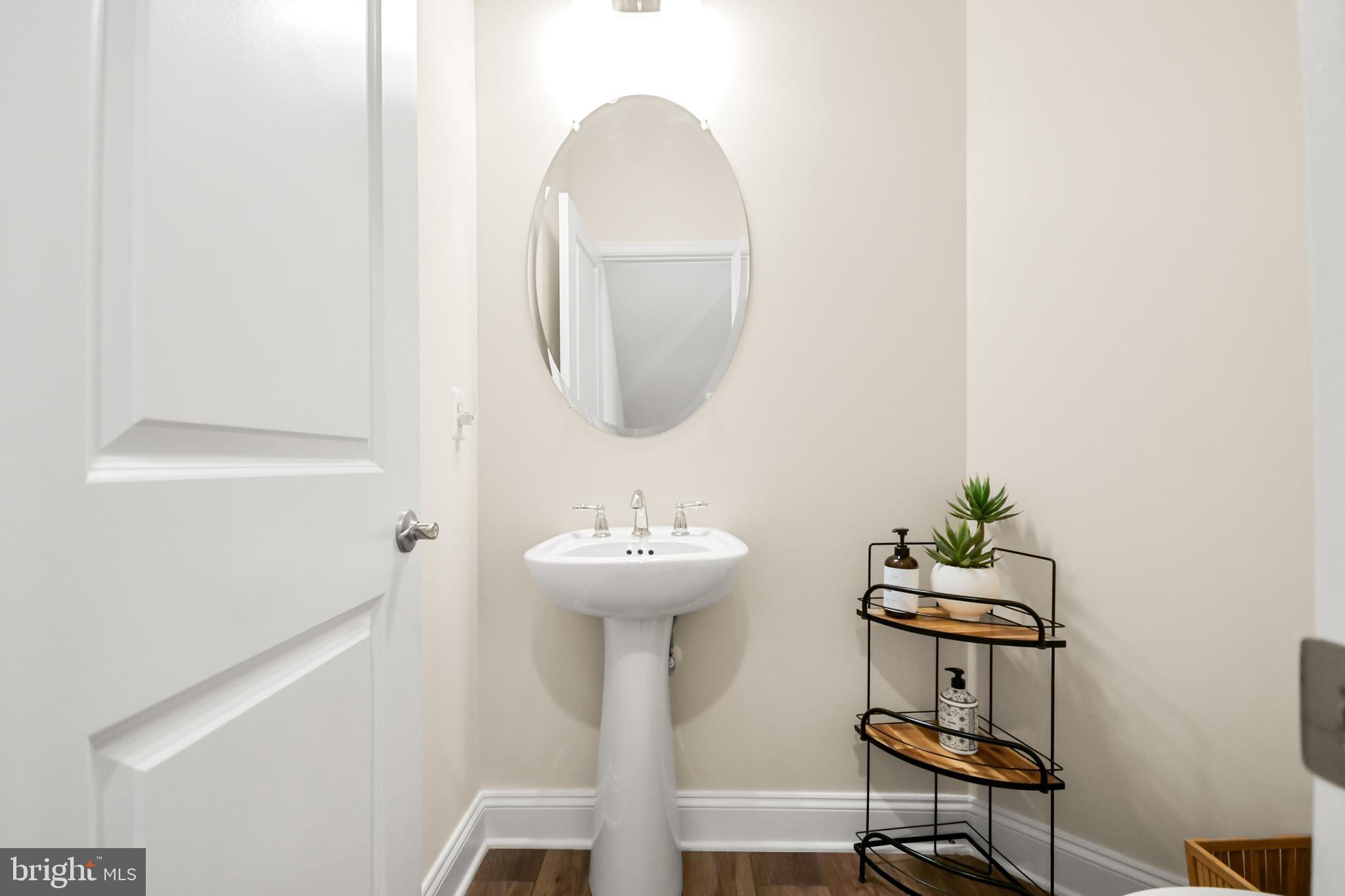 933 Holden Road Frederick, MD 21701 - Photo 58 of 80 a bathroom with a sink a mirror and a toilet