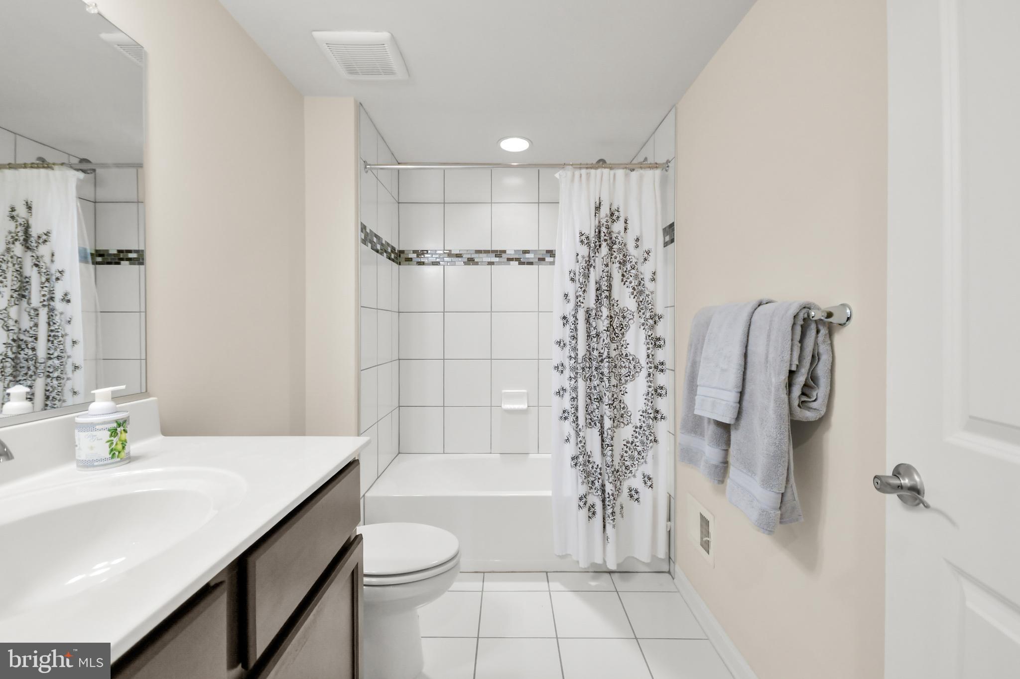 933 Holden Road Frederick, MD 21701 - Photo 62 of 80 a bathroom with a shower a toilet and sink
