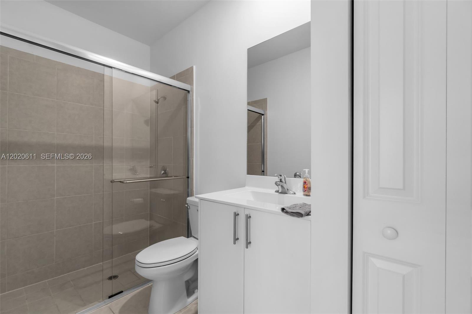 26455 Southwest 148th Avenue Homestead, FL 33032 - Photo 17 of 35 a bathroom with a sink toilet and shower