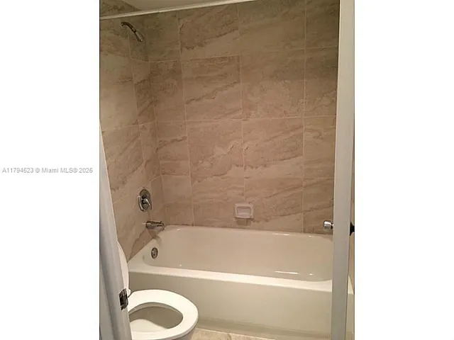 a bathroom with a shower and a bathtub