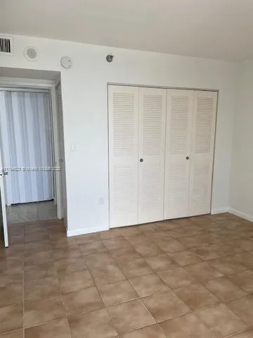 a bathroom with a toilet sink and shower