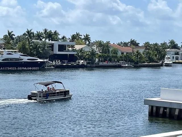 a car parked in front of a lake