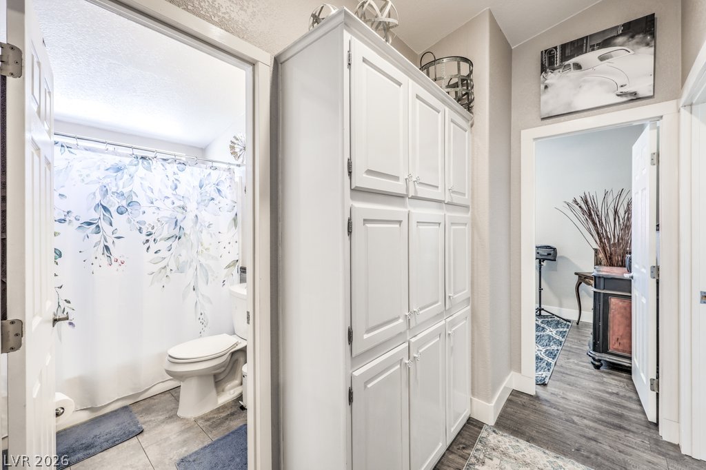 4375 Pinwheel Street Logandale, NV 89021 - Photo 28 of 52 Smartly designed hallway with built-in storage leading to a comfortable bathroom.
