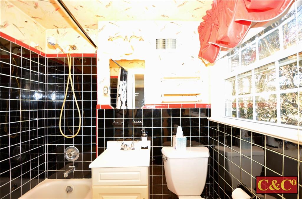 24 Wilbur Road Bergenfield, NJ 07621 - Photo 12 of 27 a bathroom with a sink toilet and shower