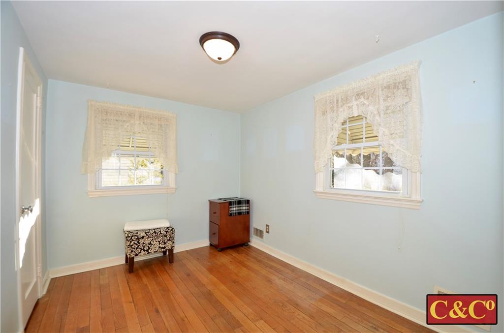 24 Wilbur Road Bergenfield, NJ 07621 - Photo 13 of 27 a room with furniture and a window