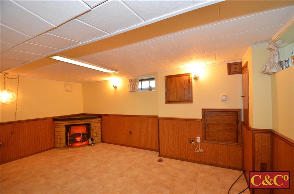 24 Wilbur Road Bergenfield, NJ 07621 - Photo 16 of 27 a view of a room with cabinet mirror and a wooden floor