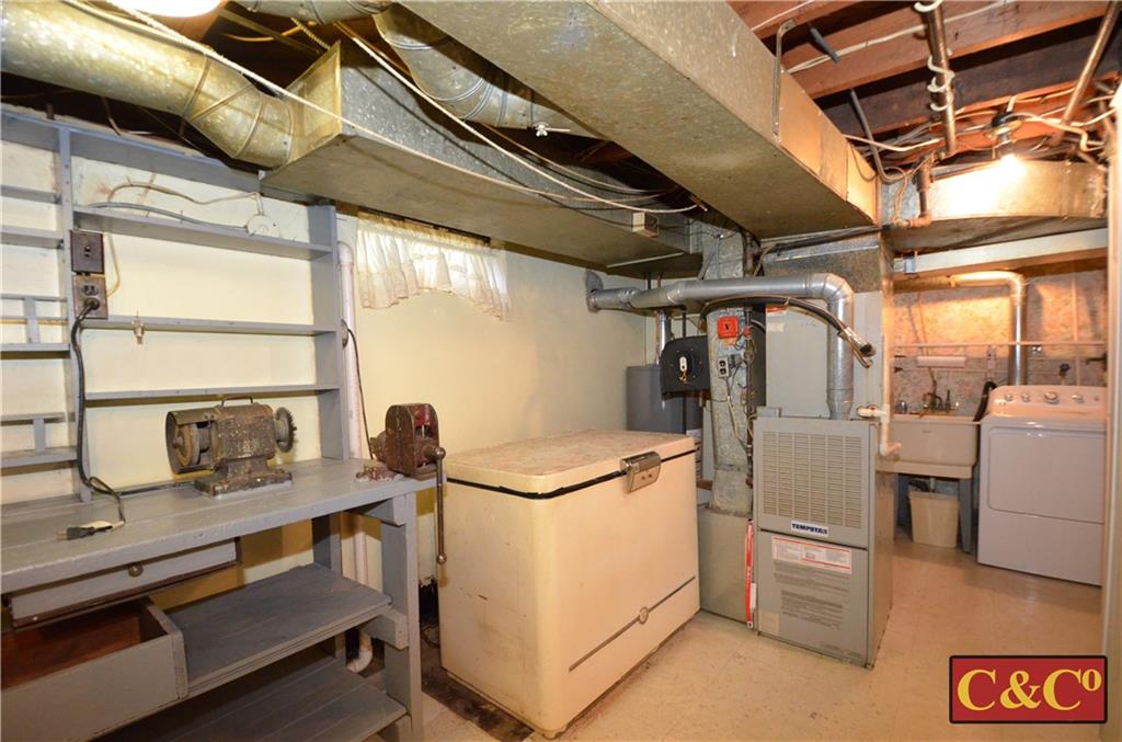 24 Wilbur Road Bergenfield, NJ 07621 - Photo 17 of 27 a view of storage and utility room with washer and dryer