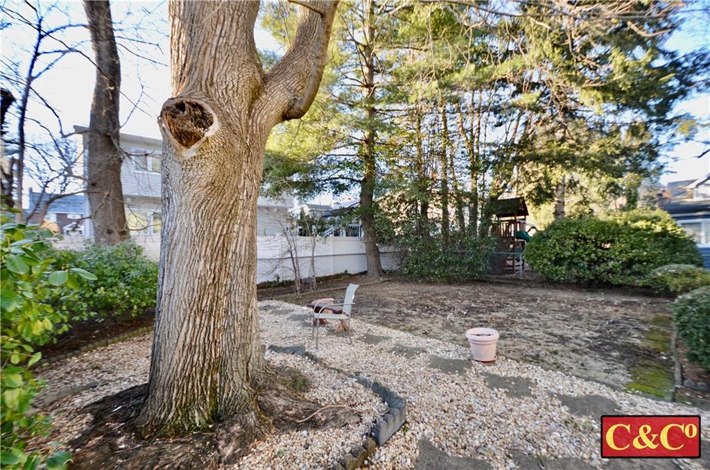 24 Wilbur Road Bergenfield, NJ 07621 - Photo 20 of 27 a backyard of a house with lots of green space