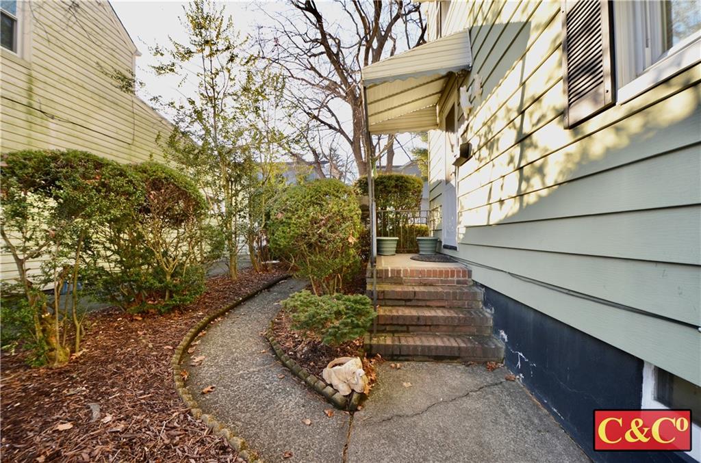 24 Wilbur Road Bergenfield, NJ 07621 - Photo 2 of 27 a view of a pathway of a house with a yard